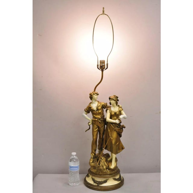 Antique French Renaissance Moreau Figural Metal Table Lamp, Wife & Farmer. Circa Early 20th Century. Measurements: 42.5" H...