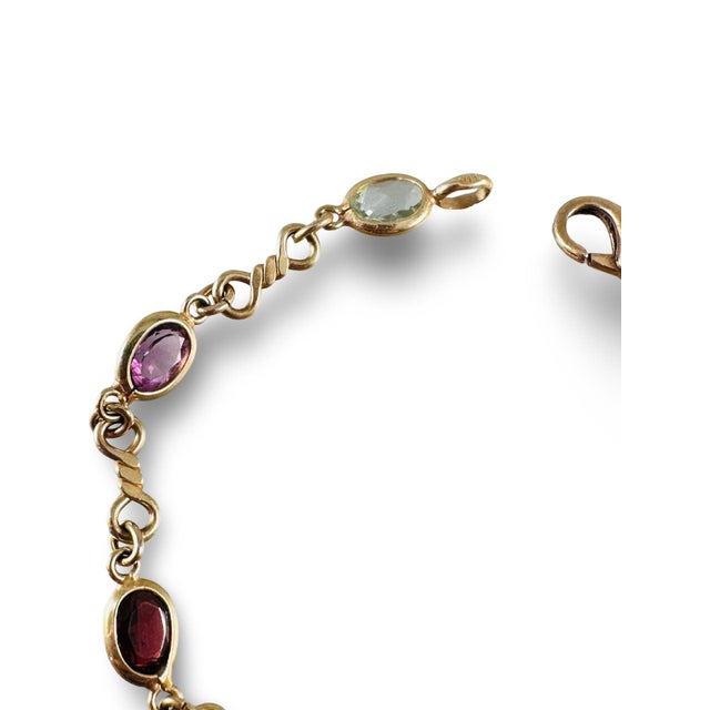 Beautiful 14k gold link bracelet with multi colored gemstones. Sweet and colorful bracelet, made in Italy. Oval faceted...