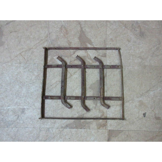 This iron window is a wonderful piece of architecture and is heavy, tight, and sturdy. The piece does shown signs of wear...