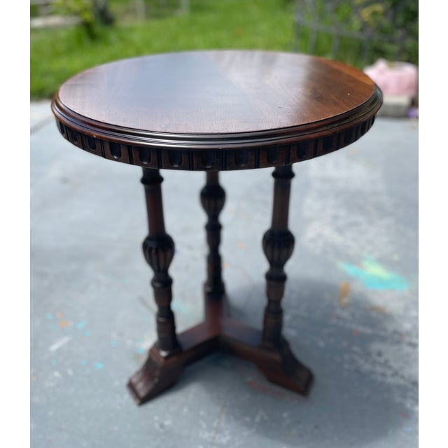 Elegant vintage Kittinger Furniture Company round side table, crafted in richly finished mahogany and distinguished by its...