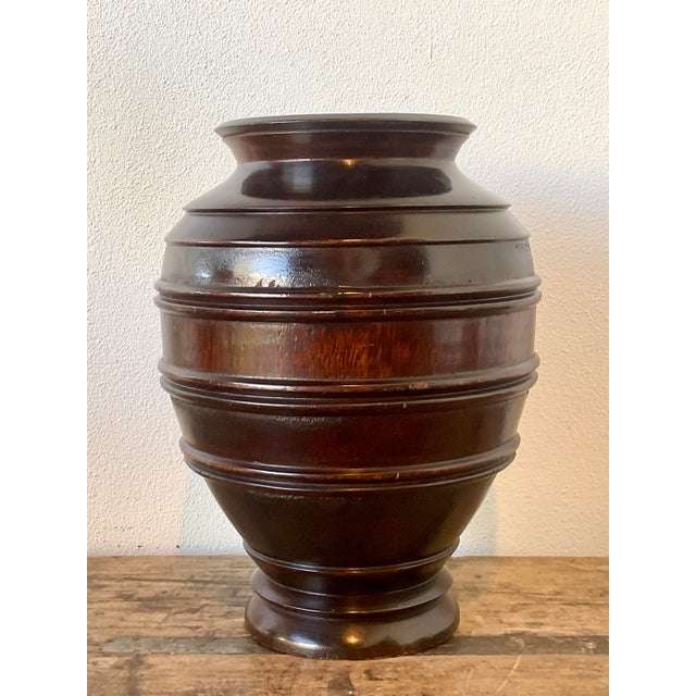 This vintage hand-turned wood urn is a striking example of sculptural Modernist decor, perfect for adding warmth and...