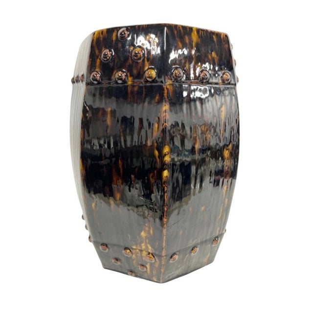 vintage ceramic garden stool, showcasing a rich, high-gloss tortoiseshell glaze. Designed in an elegant octagonal, barrel-...