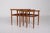 1960s: Three nesting teak coffee tables in Scandinavian style. A sliding mechanism is integrated under the tabletop to...