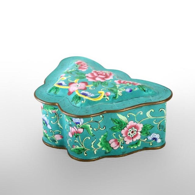 An antique Chinese cloisonné enameled trinket box, dating to approximately 1920, meticulously crafted in the distinctive...