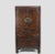 Adorned with intricate, handpainted scenes on the doors and drawers, this antique cabinet exemplifies the concept of...