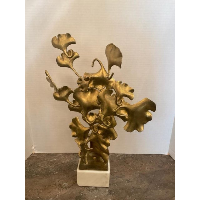 This listing features brass Gingko Leaves sculpture that sits on a marble base. Gingko leaves come from a Gingko biloba...