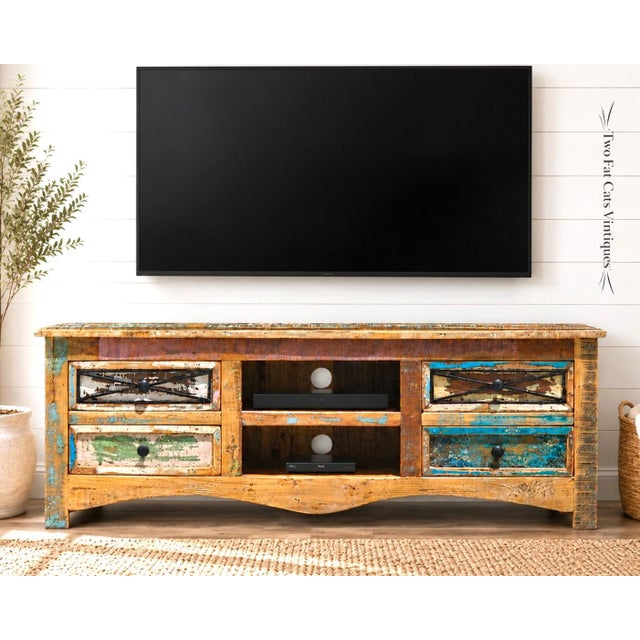 Bring vibrant character, warmth, and rustic charm into your living room with this hand-crafted media console. Built from...