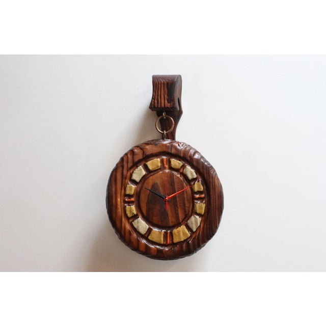 Witco clock connected via brass hardware to a wall mount ( ca. 1970s, USA). Composed of solid red cedar with hand-...