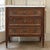 French Louis XVI Mahogany Marble Top Commode is an elegant design including a white marble top, three drawers, and...