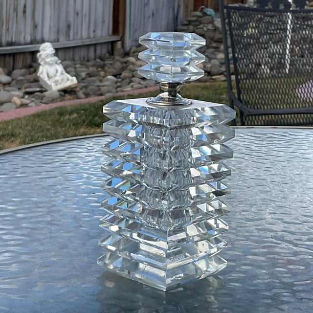 Gorgeous Perfume Bottle by Shannon Crystal that is made with 9 faceted panels and the stopper is made of 3 faceted panels...