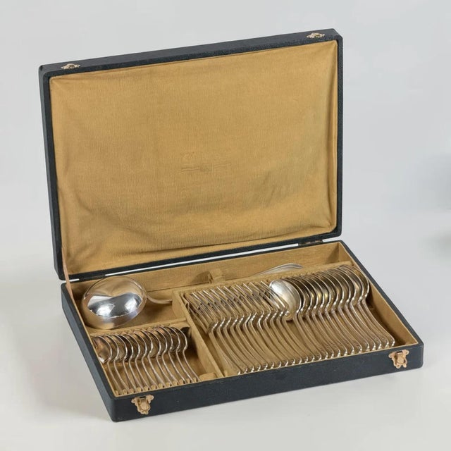 A refined early 20th-century silver-plated flatware service by the celebrated french maison christofle, presented in the...