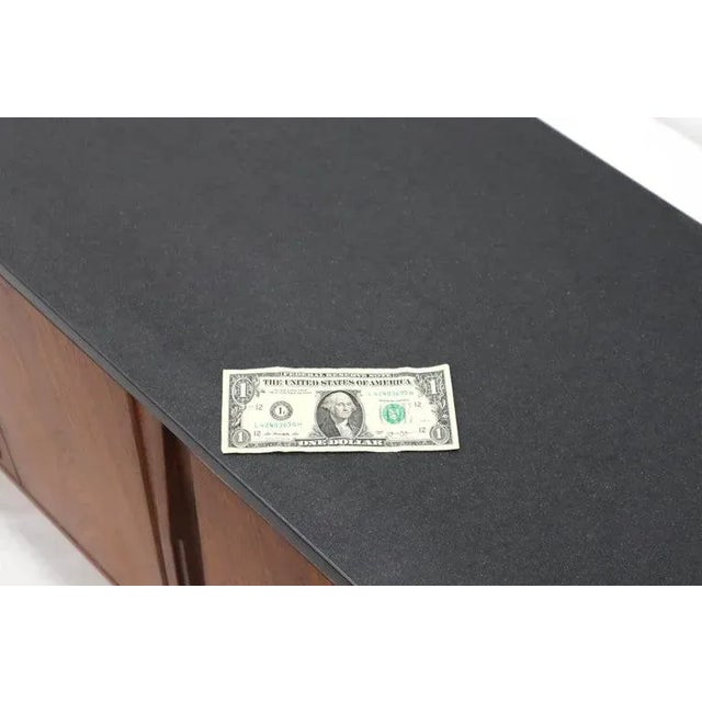 Mid-Century Modern double accordion doors walnut credenza storage cabinet with slate top. Dramatic vintage oiled walnut...