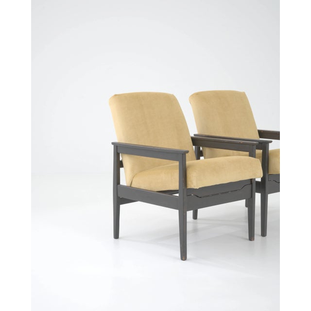 Graphic and sophisticated, this pair of vintage upholstered armchairs showcase the versatility and elegance of Central...
