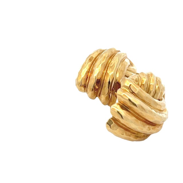 This exquisite pair of vintage earrings by master American goldsmith Henry Dunay is a bold testament to timeless elegance...