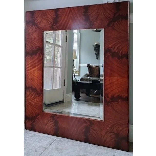 This stunning mirror is made by Ralph Lauren. It is made with solid thick mahogany wood with flamed veneers and round edge...