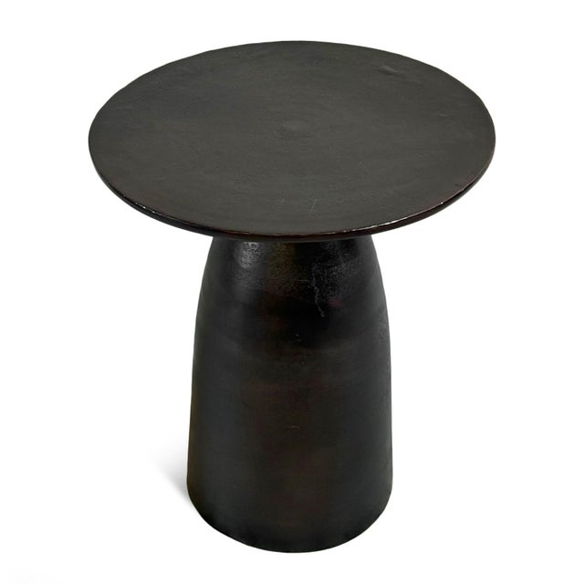 Dark copper / bronze finish aluminum side table. Modern simple round design. Each may vary slightly in patina and...