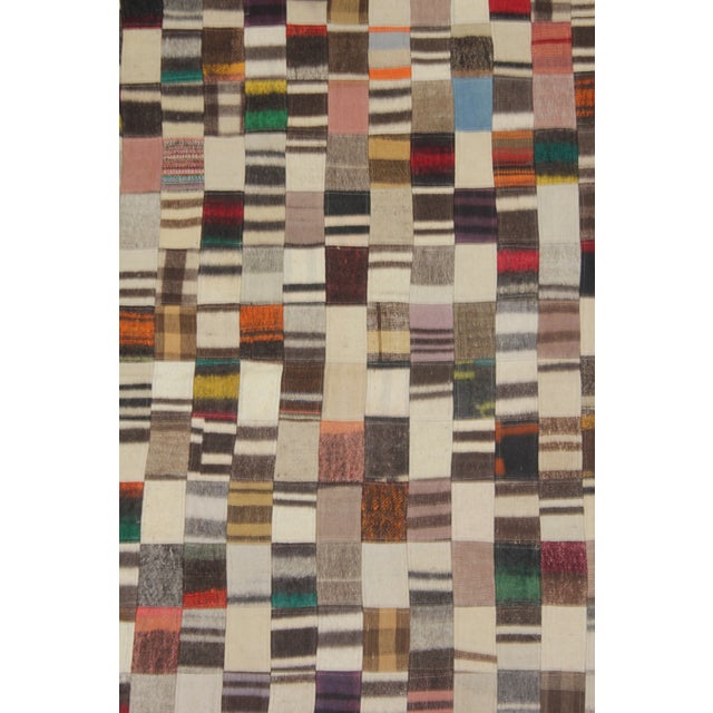A beautiful Vintage Patchwork Rug. It's in very good condition, practically new. This Patchworks rug is produced of older...