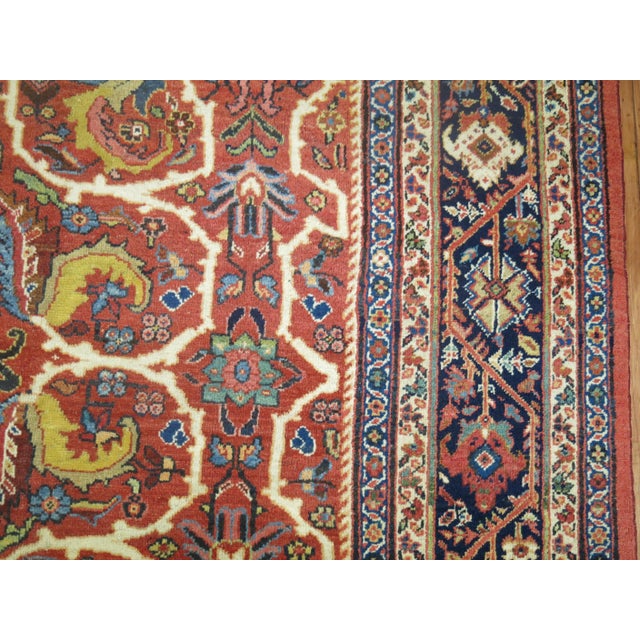 An antique Persian Mahal Sultanabad room-size decorative rug from the 1st quarter of the 20th century. Measures: 10'4” x...