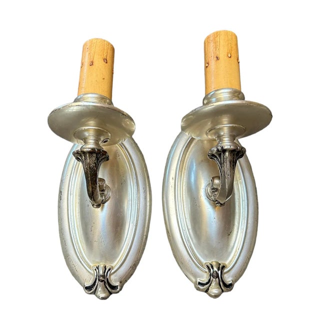 If you are looking for simple lines in a silver plate wall sconce, this is the pair for you. Traditional lines with a...