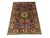 This Mamluk-design wool rug has an olive green center with an ivory rosette and surrounding motifs in rust, gold, navy,...