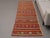 Vintage Hand-Knotted runner rug is a semi-antique vintage area rug. The '70s Eastern region of Anatolia's unique rug is...