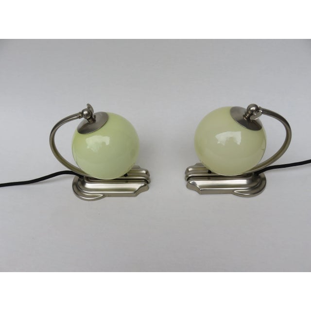 1 pair of extraordinary bedside lamps from the Art Deco period, marked WMF Ikora. The unusual shape of the stand is...