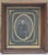 A striking and authentic pair of mid-19th century American tintype portraits, beautifully housed in deep walnut-toned...