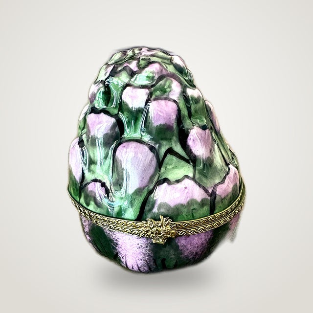 A whimsical vintage Limoges France trinket box, hand-painted and glazed to look like a blooming artichoke in soft mauve-...