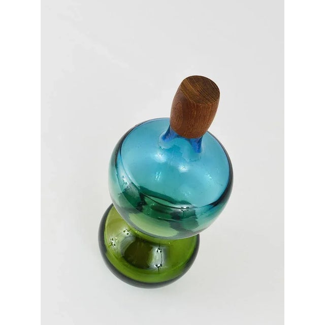 A beautiful and colorful carafe "Tropico" with teak stopper from the late 1960s, designed by Goran Warff for...