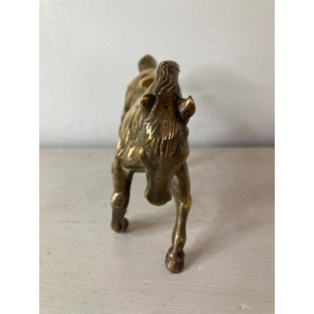 A beautifully detail horse figure in English brass. Hand sourced in and imported from England.