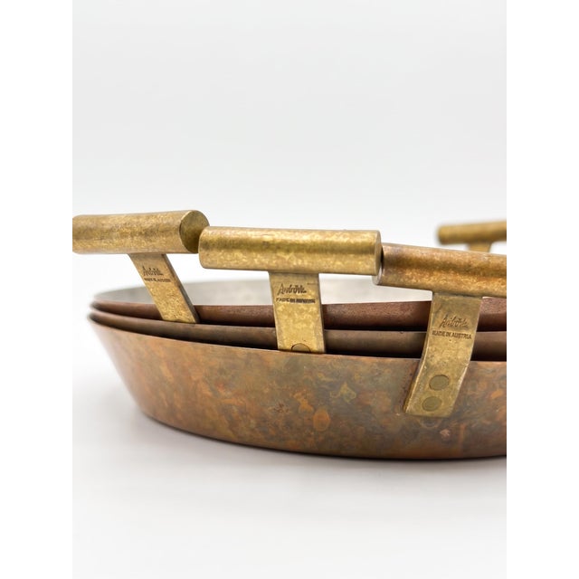 A quintessential example of Austrian design, this set of copper and brass egg pans by the renowned Werkstätte Carl Auböck...