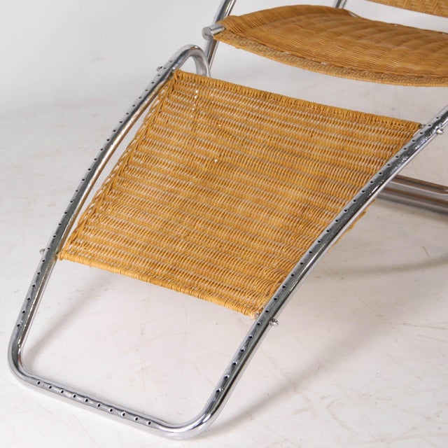 Incredible wicker and chrome chaise longue with a built-in ottoman that stores underneath. A very ingenious and...