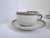 Set a four Haviland Limoges coffee cups and matching saucers. Albany pattern which Features a greek key pattern in black...