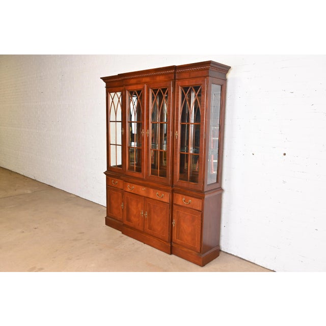 A gorgeous Georgian or Chippendale style lighted breakfront bookcase, dining cabinet, or bar cabinet By Ethan Allen USA,...
