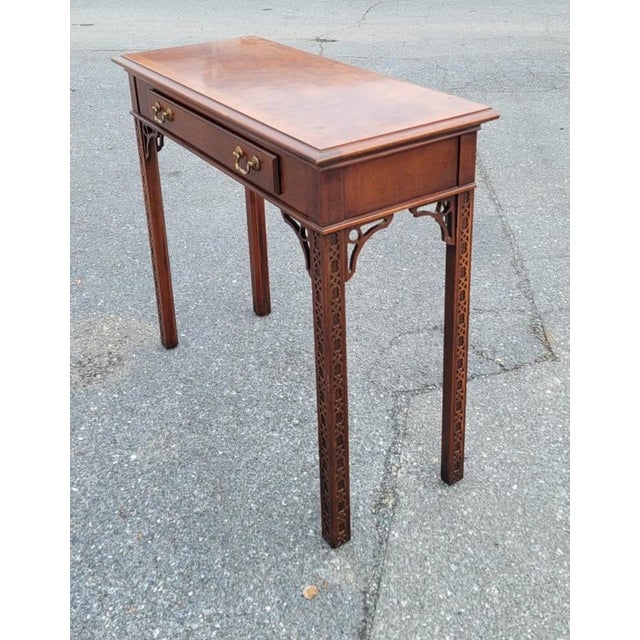 Gorgeous Chippendale walnut burl console table with beautiful banded top. Large drawer with brass pulls. Measures 36 wide,...