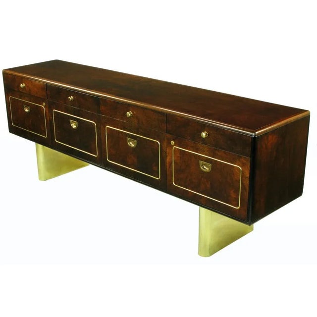 Rare Romweber Furniture dark finished burled walnut floating credenza or sideboard. Heavy brass double pedestal base,...