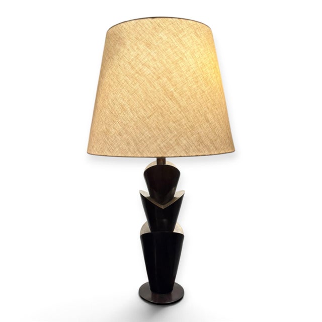 Gorgeous table lamp from Stanton, retailed through Holly Hunt. The Tulip lamp is solid bronze with angular and graceful...