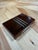 A refined vintage Italian decorative box crafted from richly figured burl wood with polished chrome accents. The...