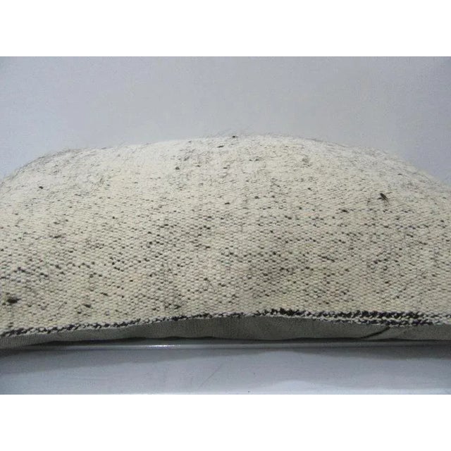 This is a pillow cover made from a vintage kilim rug. The piece was properly washed and ready to use. Pillow inserts not...