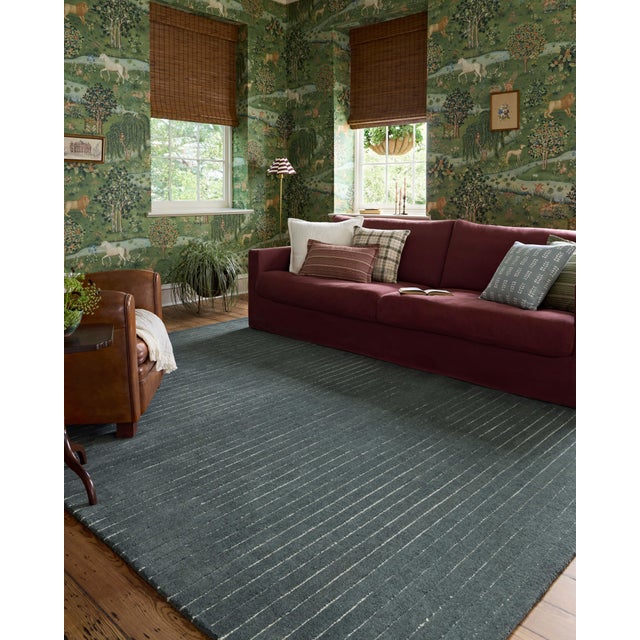 The Henry Collection from Chris Loves Julia x Loloi is a hand-tufted area rug that adds a touch of personality to a solid-...