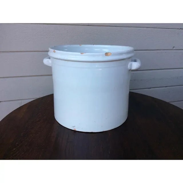 Found in Lyon, France this glazed terracotta French pottery bowl was probably used in the kitchen. The piece features two...