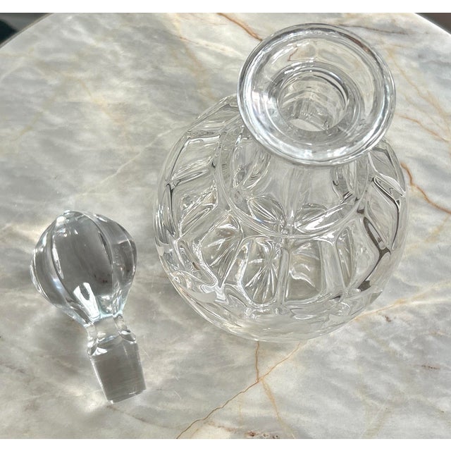 The decanter stands 8 inches tall from the base to the top opening and reaches 11 inches when the stopper is included....