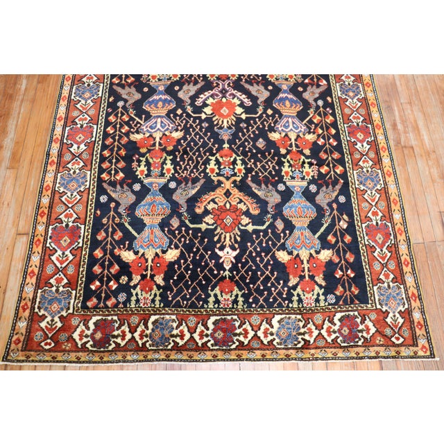an early 20th century Persian Bakhtiari Gallery size rug Measures: 5'8'' x 11'4''.