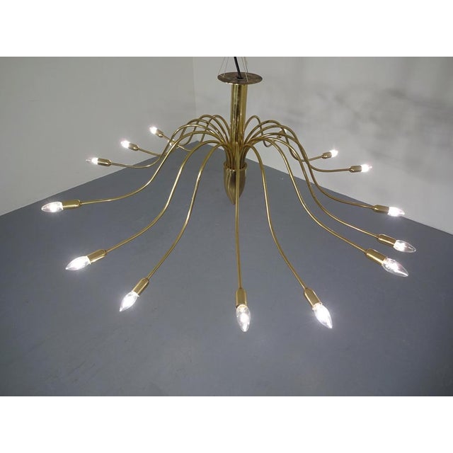 Huge Italian brass lamp from the 1960s. Diameter of the lamp 123 cm. Height 50 cm. A total of 15 burning points. Minor...