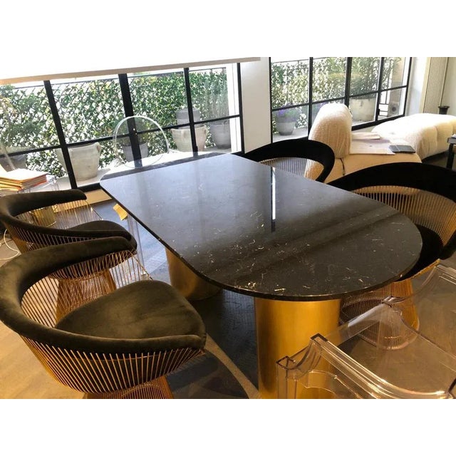 The Ovale NQ1 Dining Table is a perfect blend of geometric simplicity and sculptural artistry, designed to transform any...