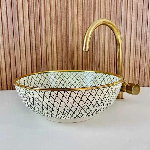 Our Gold Ceramic Sink is stunning addition to elevate your bathroom decor. Handcrafted with meticulous attention to...