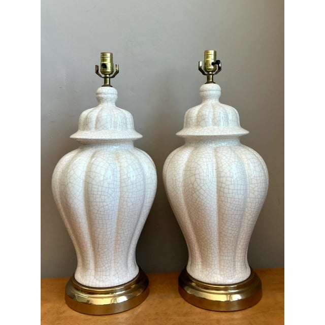 Crafted with classic ginger jar contours and delicate textural depth, this pair of vintage ceramic table lamps features...