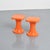Pair of orange plastic stools produced by S.E.L.U.P., France, circa 1970. Each stool features a molded, Space Age-inspired...