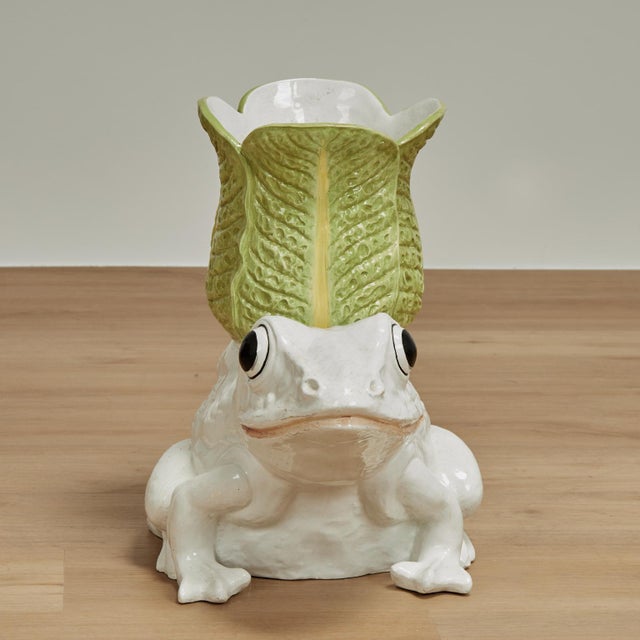 Charming vintage Italian frog carrying a faux leaf planter, crafted in a ceramic and glazed. Stamped Italy on the bottom.