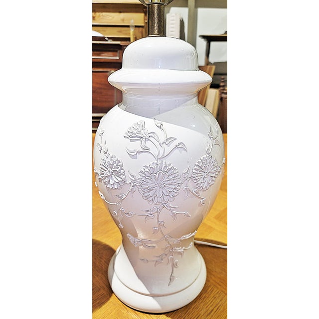 We love these plump porcelain potbelly table lamps in a lovely soft white with raised porcelain floral decor on front....